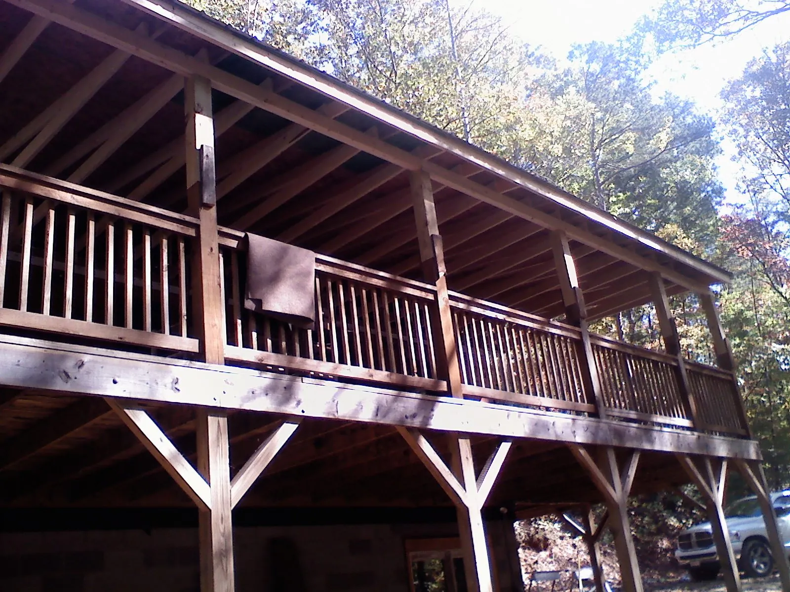 Timber framing under a new elevated porch and deck — Roof Leak Repair in Westfir by Roofing Brothers